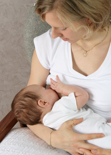 A woman breastfeeding a baby