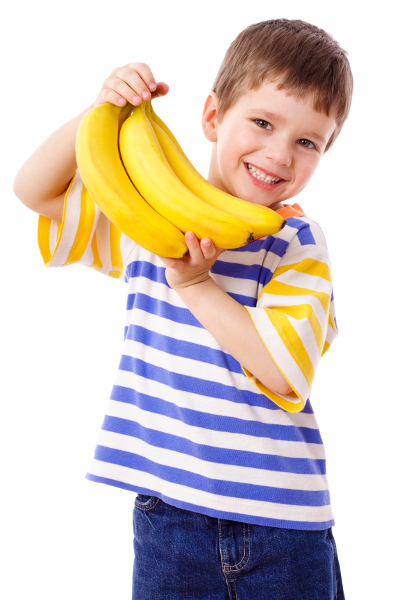 A child holding a bunch of bananas